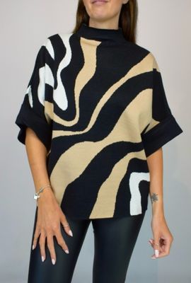 Woman Wearing Camel, Black and White High Neck Contrast Swirl Light Knit Jumper