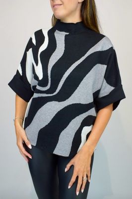 Woman Wearing Grey, Black and White High Neck Contrast Swirl Light Knit Jumper