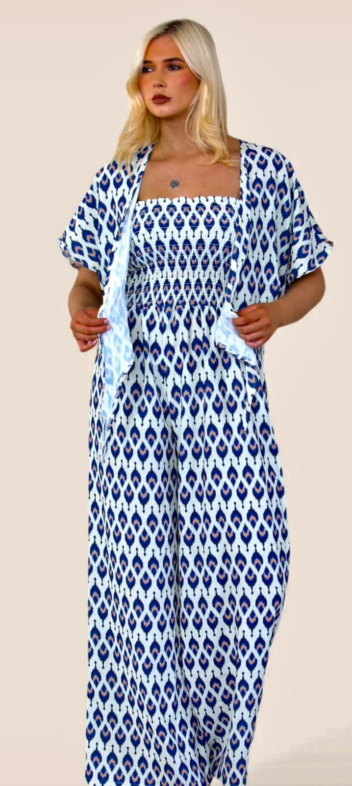 Woman Wearing Printed Geometric Jumpsuit With Bolero Jacket in Navy