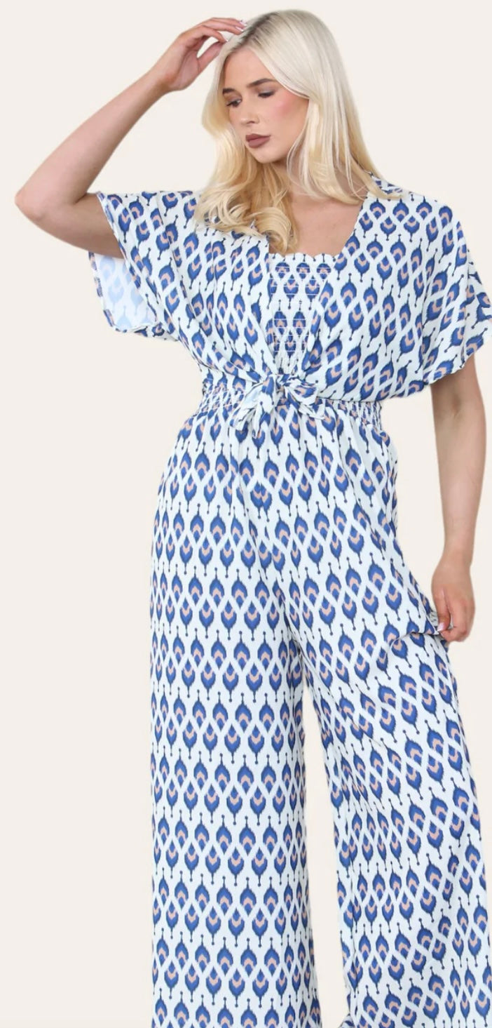 Woman Wearing Printed Geometric Jumpsuit With Bolero Jacket in Navy