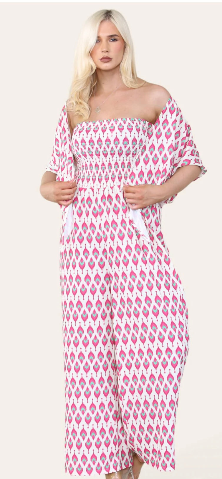 Woman Wearing Printed Geometric Jumpsuit With Bolero Jacket in Pink.