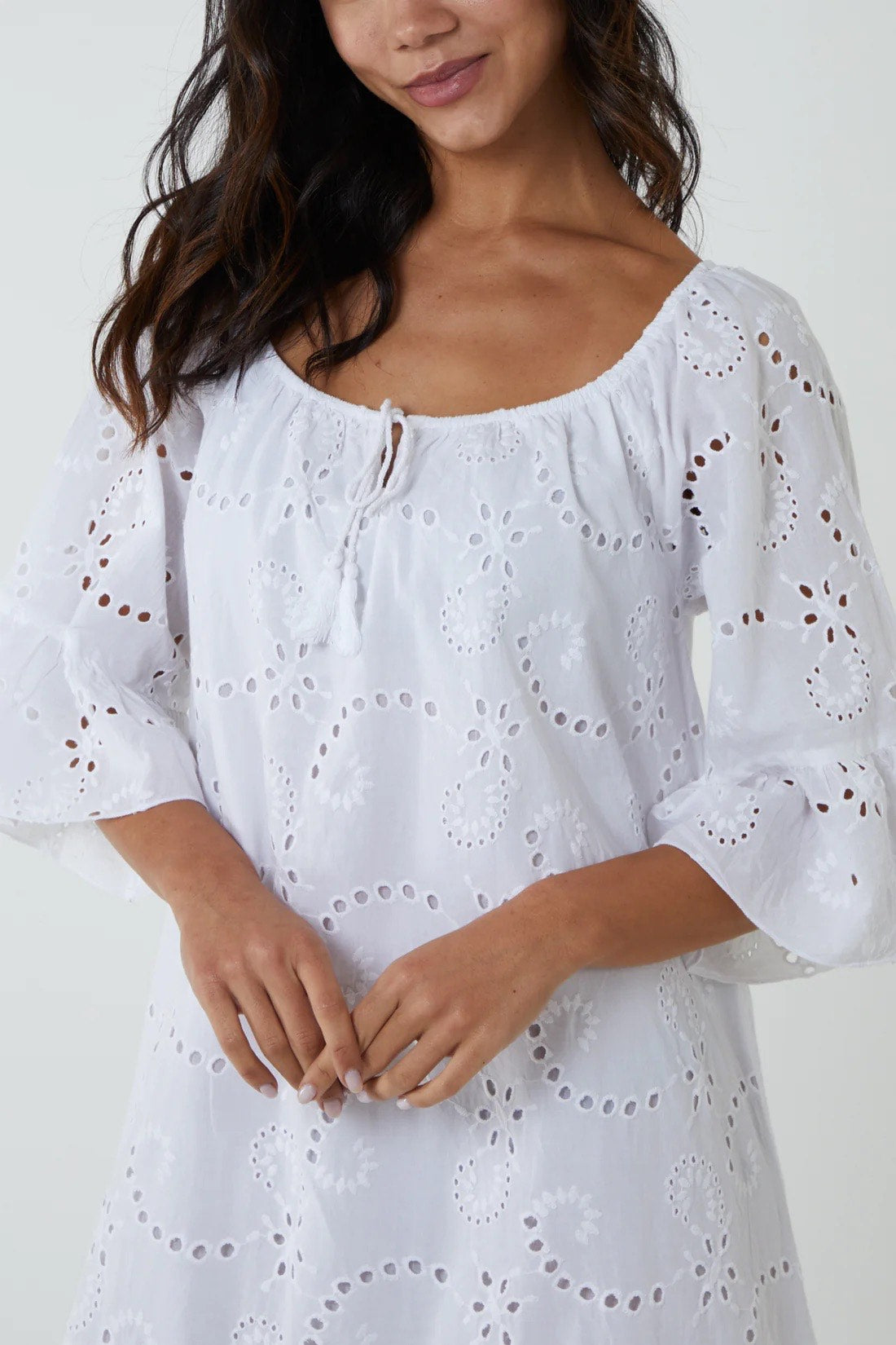 Woman wearing White Broderie Anglaise Bardot Dress